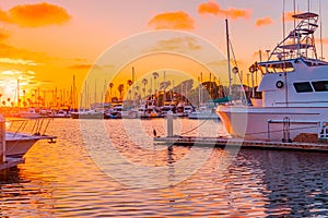 Sunset hits the Oceanside Harbor and glows on boats and water