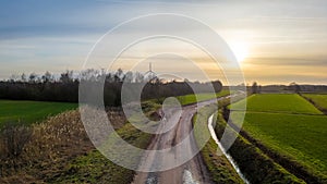 Sunset Horizon Over Winding Country Road