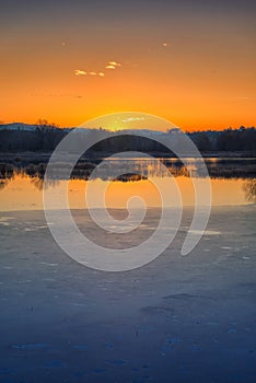 Sunset on iced water