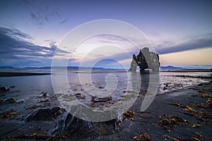 Sunset at the iconic Hvitserkur, a monolithic sea stack in north of Iceland