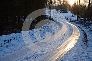 Sunset by an icy country road