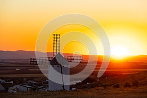 Historic windmill standing at sunset in Campo de Criptana