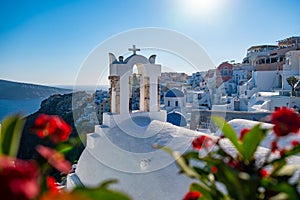 Sunset at the Island Of Santorini Greece, beautiful whitewashed village Oia with church and windmill during sunset