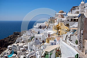 Sunset at the Island Of Santorini Greece, beautiful whitewashed village Oia with church and windmill during sunset