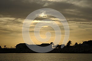 The sunset on the island of Tabarca, on a winter sunset photo