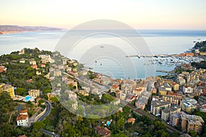 Sunset in italian riviera. Top view of a small town with traditional italian houses close to the coastline of Ligurian Sea, Santa