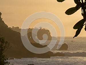 Sunset in Jimbaran Bay Bali with local fishermen in the foreground