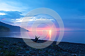 The sunset at Lake Baikal in summer