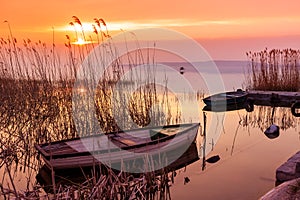Sunset on the lake Balaton with a boat photo
