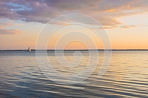 Sunset at Lake Balaton in Hungary, Calm water surface, pretty clouds, Concept, Holiday landscape