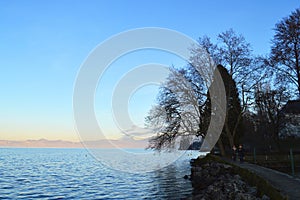 Sunset on the lake, calm water. Lake Geneva at sunset, Evian, France