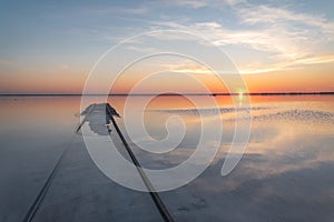 Sunset lake clouds rails reflection salt horizon