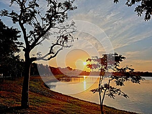 Sunset in a lake on a cloudy day