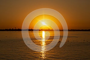 sunset on the lake Guaiba located in Porto Alegre, Rio Grande do Sul, Brazil