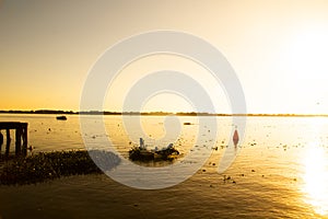 sunset on the lake Guaiba located in Porto Alegre, Rio Grande do Sul, Brazil