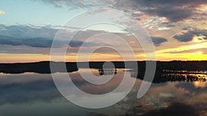 Sunset lake landscape with sky reflection. Panoramic view