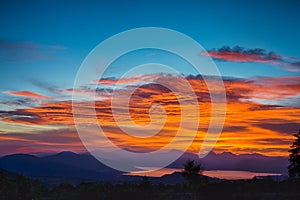 Sunset over the Patzcuaro lake with a sky of fire and intense blue