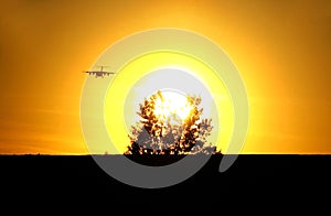 Sunset and landing of aircraft