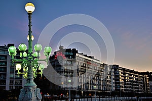 Light lamp with the historic Hotel Londres on the background in Donostia photo