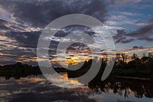 Sunset Landscape. Reflection on River Sky and Clouds