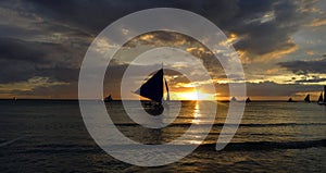 Sunset landscape. Sailboat on coast of Boracay island. Philippines