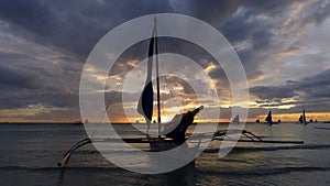 Sunset landscape. Sailboat on coast of Boracay island. Philippines