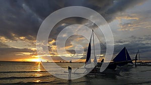 Sunset landscape. Sailboat on coast of Boracay island. Philippines