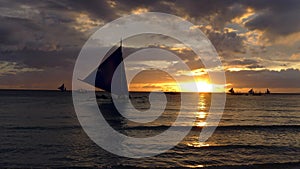 Sunset landscape. Sailboat on coast of Boracay island. Philippines