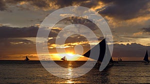 Sunset landscape. Sailboat on coast of Boracay island. Philippines