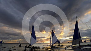 Sunset landscape. Sailboat on coast of Boracay island. Philippines