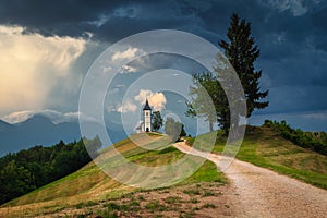 Sunset landscape with Saint Primoz church, near Jamnik, Slovenia