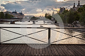 Sunset landscape on the Seine River in Paris from the Pont des Arts