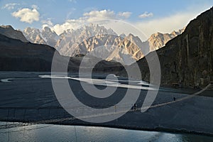 Sunset Light Over Passu Cones and Hussaini Suspension Bridge in Hunza, Pakistan