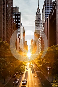 Sunset light shining on the buildings and cars on 42nd Street in Midtown New York City around the time of the Manhattanhenge