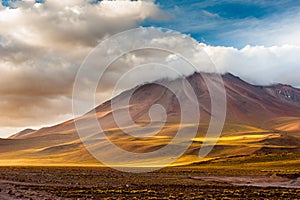 Sunset light on volcanos of Atacama Desert. Mountains southern from San Pedro de Atacama. Stunning scenery in evening sunlight at