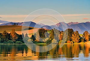 Sunset on Liptovska Mara dam with West Tatras on horizont