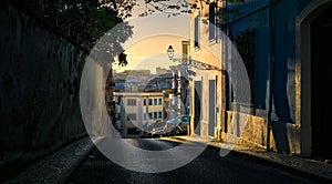 Sunset in Lisbon. City streets.Funicular Lavra. Portugal. photo