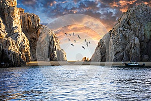 Sunset on a little beach close to Cabo San Lucas\' El Arco Arch. photo