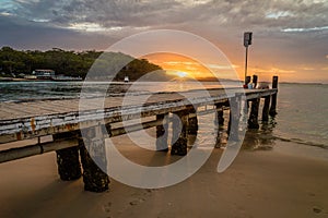 Sunset from Little beach pier in Port Stephens and Nelson Bay, Australia photo