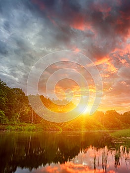 Sunset long the banks of the Amazon river. The tributaries of the Amazon traverse the countries of Guyana, Ecuador, Peru, Brazil,