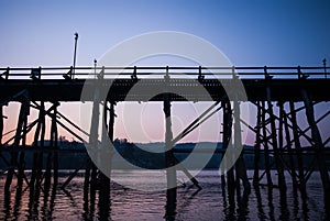 Sunset at the longest wooden bridge and floating Town in Sangklaburi Kanchanaburi Thailand