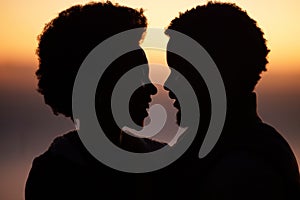 Sunset, love and silhouette of black couple in nature for romance, bonding and happiness. Sunrise, travel and summer