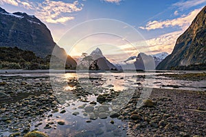 Sunset during low tide at Milford Sound, Southland, New Zealand`s South Island.