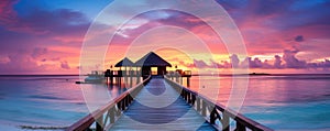 Sunset on Maldives island, luxury water villas resort and wooden pier.AI Generated