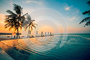 Sunset on Maldives island, luxury water villas resort and wooden pier. Beautiful sky and clouds and beach background for summer