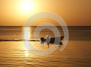 Sunset with man in boat