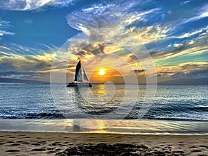 Sunset in Maui, Hawaii. Catamaran vacation and tourist destination.