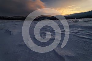 Winter sunset on meadows