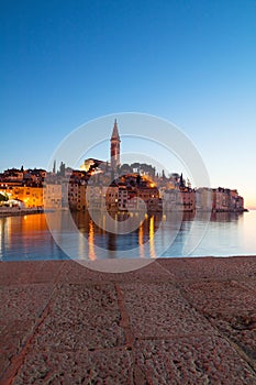 Sunset at medieval town of Rovinj, colorful with houses and church