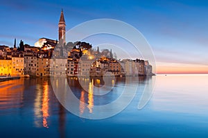 Sunset at medieval town of Rovinj, colorful with houses and church